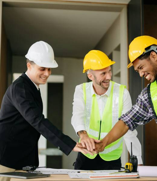 Engineer and contractor join hands after signing contract,They are having